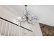 Close-up of the modern chandelier hanging above the staircase and living area at 1069 Falling Water Se Dr, Smyrna, GA 30080