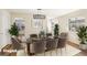 Elegant dining room with a modern table, chairs, and stylish light fixture at 1069 Falling Water Se Dr, Smyrna, GA 30080