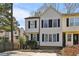 Lovely two-story home featuring light siding, dark shutters and a well-maintained front yard in a suburban setting at 1069 Falling Water Se Dr, Smyrna, GA 30080
