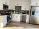 Bright kitchen featuring stainless steel appliances and stylish white cabinets at 1069 Falling Water Se Dr, Smyrna, GA 30080