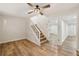 This living room is adjacent to the stairs with a view of the basement at 1069 Falling Water Se Dr, Smyrna, GA 30080