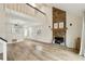 Staged living room with high ceilings, open floorplan, and a decorative stone fireplace at 1069 Falling Water Se Dr, Smyrna, GA 30080