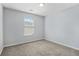 Bright bedroom with a large window and neutral walls, offering a serene atmosphere at 2502 Capella Sw Cir, Atlanta, GA 30331