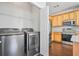 Laundry room with modern washer and dryer units adjacent to the kitchen at 2502 Capella Sw Cir, Atlanta, GA 30331