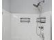 Bright shower features a shower head and convenient shelving for toiletries at 2502 Capella Sw Cir, Atlanta, GA 30331