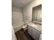 This bathroom has a shower-tub combination and a vanity with granite countertop at 276 Shawnee Trl, Dallas, GA 30157