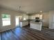 Bright kitchen features white cabinets, stainless steel appliances, and an island at 322 Shawnee Trl, Dallas, GA 30157