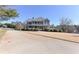 Stately two-story home with a wraparound porch, lush landscaping and a long driveway at 3440 Caleb Rd, Snellville, GA 30039