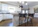 Bright kitchen with island seating, white cabinetry, and modern fixtures at 3440 Caleb Rd, Snellville, GA 30039