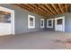 Covered patio featuring concrete floor, natural wood ceiling, and plenty of natural light at 3440 Caleb Rd, Snellville, GA 30039