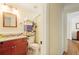 Traditional bathroom with granite countertop vanity, a wood framed mirror and a shower and tub combo at 415 S Woodland Sw Dr, Marietta, GA 30064