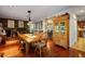 Elegant dining room featuring wood floors, a large table and an ornate light fixture at 415 S Woodland Sw Dr, Marietta, GA 30064