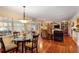 Bright living room featuring hardwood floors, a glass table and french doors leading outside at 415 S Woodland Sw Dr, Marietta, GA 30064