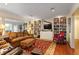 Elegant living room with built-in bookshelves, ample seating, and large windows at 415 S Woodland Sw Dr, Marietta, GA 30064