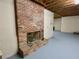 Brick fireplace in the unfinished basement, featuring exposed ceiling and providing room to be customized at 342 Mccurry Rd, Stockbridge, GA 30281