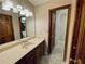 Bathroom featuring an expansive vanity with a large mirror and decorative flooring at 342 Mccurry Rd, Stockbridge, GA 30281