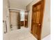 Bathroom featuring a shower with sliding glass doors next to wood trim at 342 Mccurry Rd, Stockbridge, GA 30281