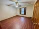 Bedroom boasts wood floors, neutral paint, ceiling fan, and wood trim at 342 Mccurry Rd, Stockbridge, GA 30281