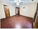 Bedroom boasts wood floors, neutral paint, shuttered window, and wood trim at 342 Mccurry Rd, Stockbridge, GA 30281