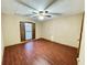 Bedroom with wood floors, shuttered windows, ceiling fan and neutral paint at 342 Mccurry Rd, Stockbridge, GA 30281