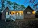 Brick home with a welcoming front porch and manicured landscaping at 342 Mccurry Rd, Stockbridge, GA 30281