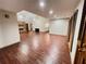 Open concept living room with wood-look tile, and brick fireplace as a focal point at 342 Mccurry Rd, Stockbridge, GA 30281