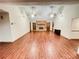 Bright living room featuring vaulted ceilings, wood floors, brick fireplace, and plenty of space for gatherings at 342 Mccurry Rd, Stockbridge, GA 30281