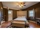 Bedroom featuring hardwood floors, plush bedding, and an open doorway to the exterior at 4985 Union St, Union City, GA 30291