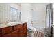 Bathroom featuring a granite countertop vanity, a shower-tub combo, and neutral decor at 6945 Merrywood Dr, Fairburn, GA 30213