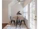 Bright breakfast nook with a round table, four chairs, and natural light at 6945 Merrywood Dr, Fairburn, GA 30213