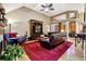 Cozy living room featuring vaulted ceilings, hardwood floors, and comfortable furniture at 135 Rockglen Ct, Fayetteville, GA 30215