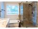 Bathroom with standalone tub and glass-enclosed shower at 6815 Fairgreen Dr, Suwanee, GA 30024