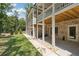 Exterior view of back porches on multiple homes with white supports and open porch at 1041 Endeavour Ct, Marietta, GA 30064