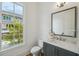 Powder room with stylish vanity, modern fixtures, and a window with a view at 1041 Endeavour Ct, Marietta, GA 30064