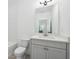 Modern bathroom featuring white cabinets, a neutral paint, and tiled walls at 1041 Endeavour Ct, Marietta, GA 30064