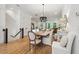 Elegant dining room with a modern chandelier and seating for six, steps to stairs at 1041 Endeavour Ct, Marietta, GA 30064