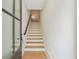 View of the entryway featuring light wood steps and flooring, leading up to the next level at 1041 Endeavour Ct, Marietta, GA 30064