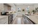 Modern kitchen equipped with stainless steel appliances, marble countertops, and white cabinetry at 1041 Endeavour Ct, Marietta, GA 30064