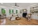 Inviting living room featuring a fireplace, built-in shelving, and lots of natural light at 1041 Endeavour Ct, Marietta, GA 30064