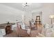 Bright living room featuring neutral paint, two accent chairs, and a decorative table at 1041 Endeavour Ct, Marietta, GA 30064