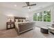 Elegant main bedroom showcases a mirrored nightstand and a seating area near the large window at 1041 Endeavour Ct, Marietta, GA 30064