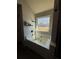 A bright bathroom with a large tub next to a window offering natural light and a backyard view at 307 Morning Frost, Canton, GA 30114