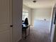 Bonus room featuring neutral carpet, a window for natural light, and a desk for work or study at 307 Morning Frost, Canton, GA 30114