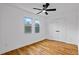 Bright bedroom featuring hardwood floors, a ceiling fan, and double door closet at 3565 Collier Drive Nw Rd, Atlanta, GA 30331