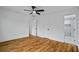 Bedroom featuring hardwood floors, an ensuite bathroom, and multiple room entry doors at 3565 Collier Drive Nw Rd, Atlanta, GA 30331