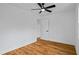 Bedroom with hardwood floors, a modern ceiling fan and multiple closet and room entry doors at 3565 Collier Drive Nw Rd, Atlanta, GA 30331