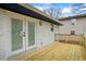 View of a wooden deck with glass paneled doors leading into the house at 3565 Collier Drive Nw Rd, Atlanta, GA 30331