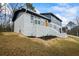 Beautiful modern home has a painted brick exterior with a bright orange front door at 3565 Collier Drive Nw Rd, Atlanta, GA 30331