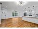 Open-concept living room with modern lighting, and a kitchen island at 3565 Collier Drive Nw Rd, Atlanta, GA 30331