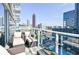 Condo balcony with seating and panoramic city views at 45 Ivan Allen Jr Nw Blvd # 1908, Atlanta, GA 30308